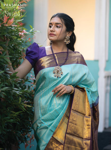 Pure kanjivaram silk saree light blue and violet with allover silver & gold zari weaves and long zari woven border