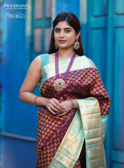 Pure kanjivaram silk saree deep purple and teal blue shade with allover annam zari woven butta weaves and rich zari woven border