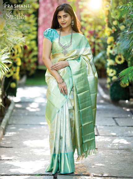 Pure kanjivaram tissue silk saree cream and teal blue with allover zari woven brocade weaves and zari woven border