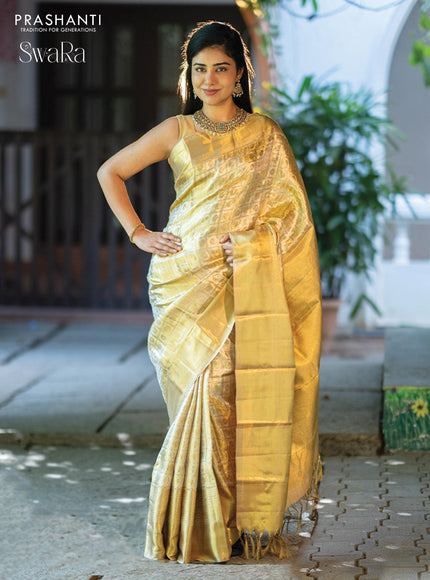 Pure kanjivaram tissue silk saree gold with allover zari woven brocade weaves and long zari woven border