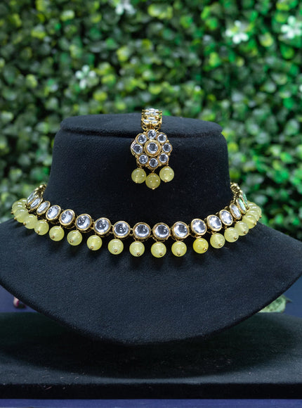 Kundan necklace with yellow beads hangings and maang tikka