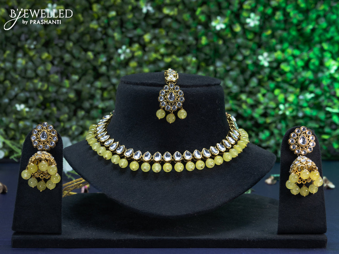 Kundan necklace with yellow beads hangings and maang tikka