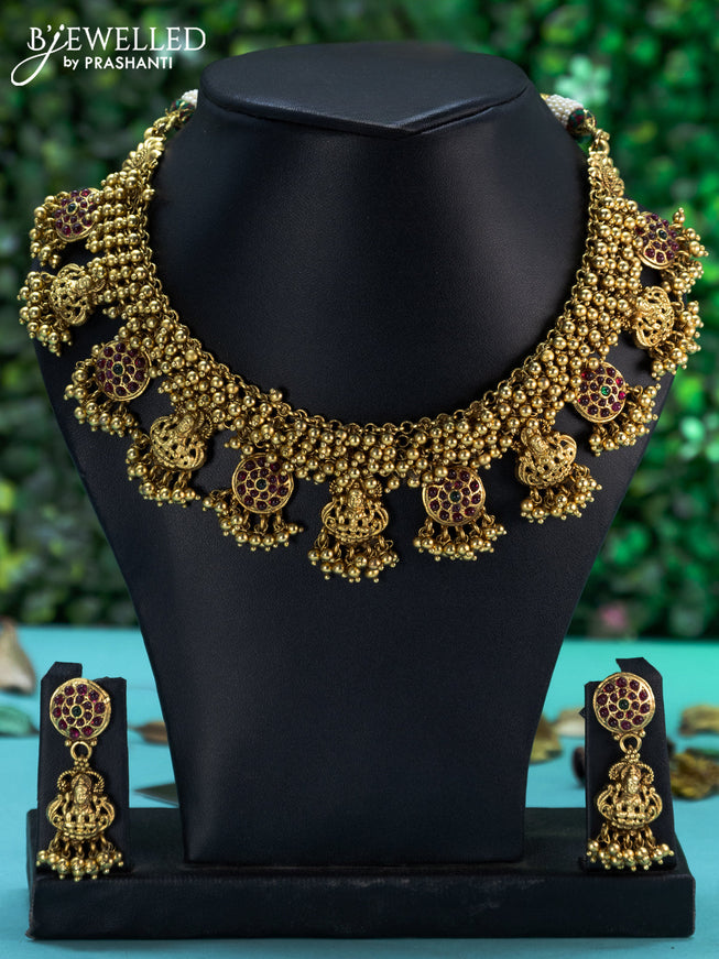 Antique necklace lakshmi design with kemp stones and golden beads hangings