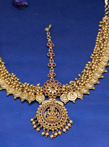 Antique maang tikka lakshmi design with pink kemp stones and golden beads hangings