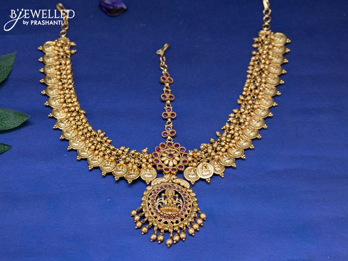 Antique maang tikka lakshmi design with pink kemp stones and golden beads hangings