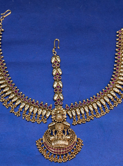 Antique maang tikka lakshmi design with pink kemp stones and golden beads hangings