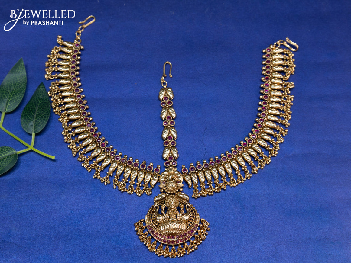 Antique maang tikka lakshmi design with pink kemp stones and golden beads hangings