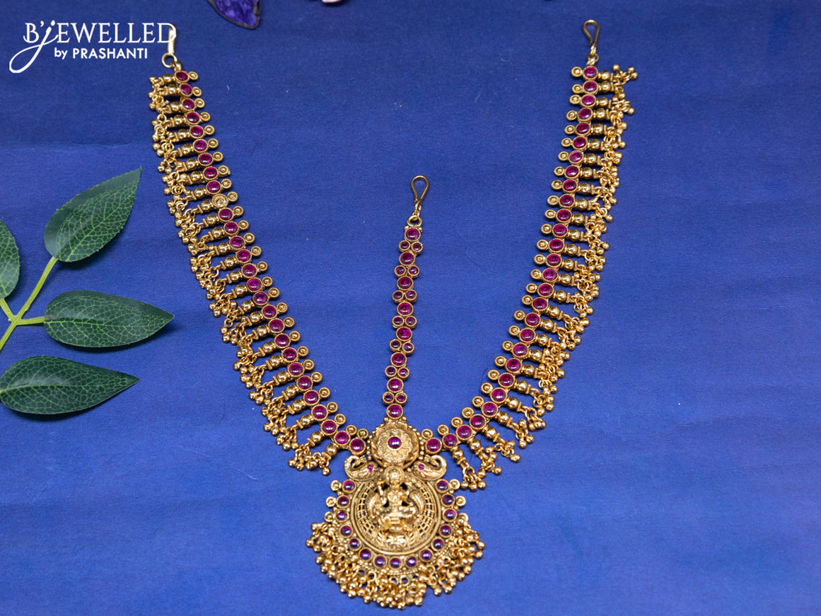 Antique maang tikka lakshmi design with pink kemp stones and golden beads hangings