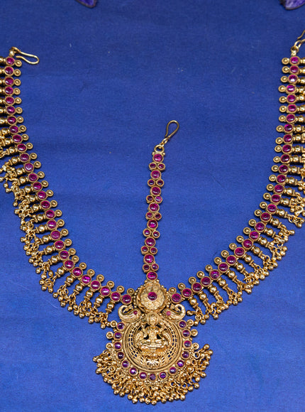 Antique maang tikka lakshmi design with pink kemp stones and golden beads hangings