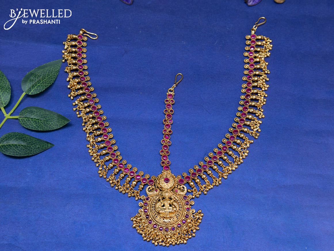 Antique maang tikka lakshmi design with pink kemp stones and golden beads hangings