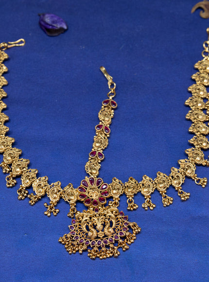 Antique maang tikka peacock design with pink kemp stones and golden beads hangings