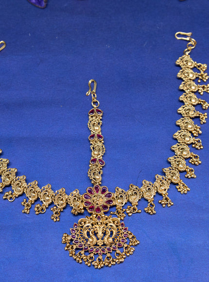 Antique maang tikka peacock design with pink kemp stones and golden beads hangings