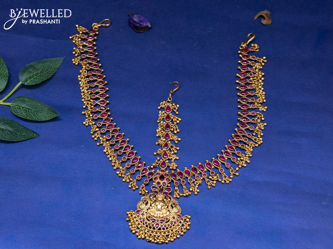 Antique maang tikka lakshmi design with pink kemp stones and golden beads hangings