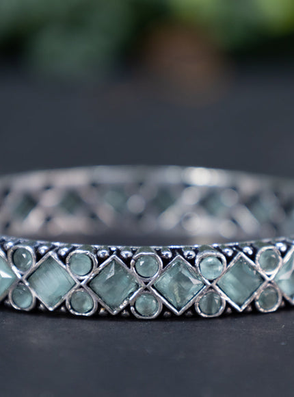 Oxidised bangle with mint green stones