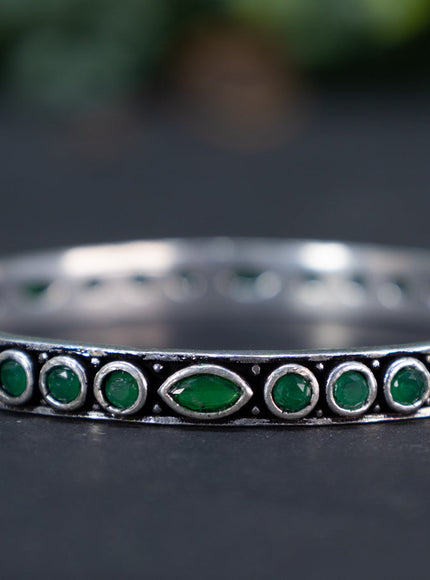 Oxidised bangle with emerald stones