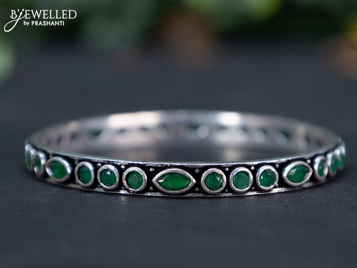 Oxidised bangle with emerald stones