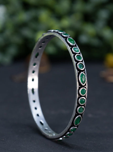 Oxidised bangle with emerald stones