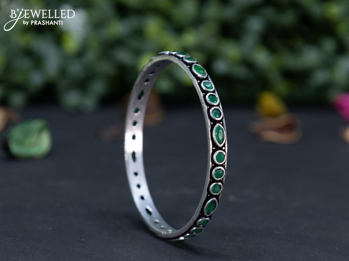 Oxidised bangle with emerald stones