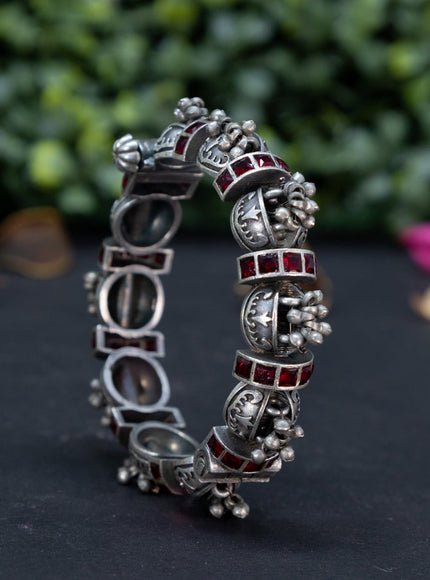 Oxidised screw type bangle with maroon stones