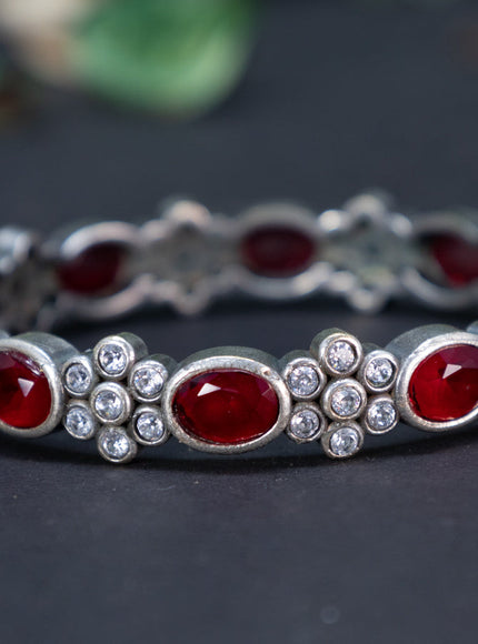 Oxidised screw type bangle with maroon and cz stones