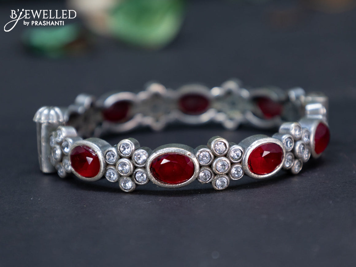 Oxidised screw type bangle with maroon and cz stones