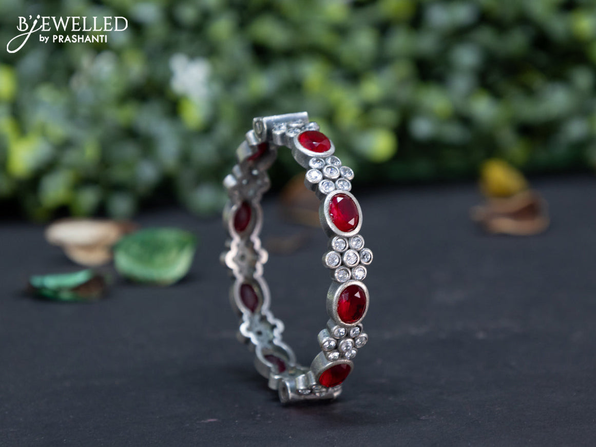 Oxidised screw type bangle with maroon and cz stones