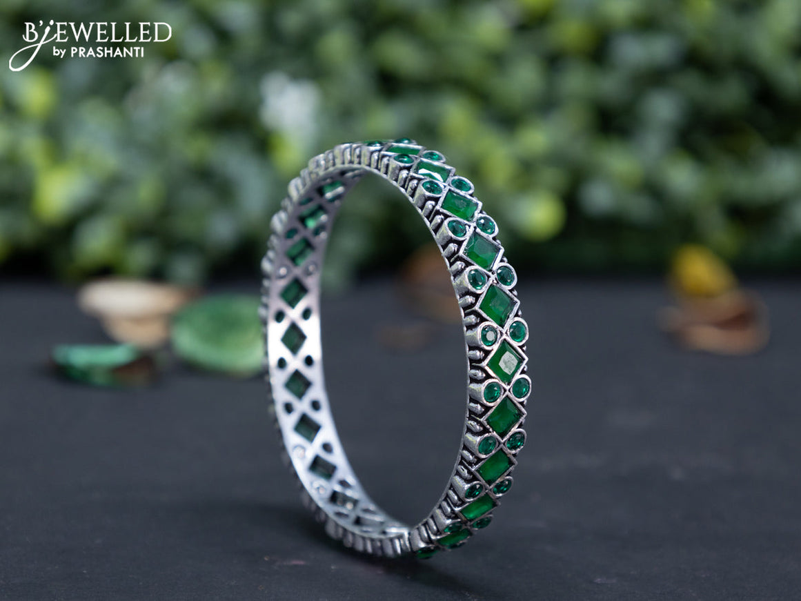 Oxidised bangle with emerald stones