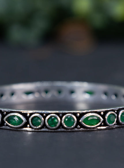 Oxidised bangle with emerald stones