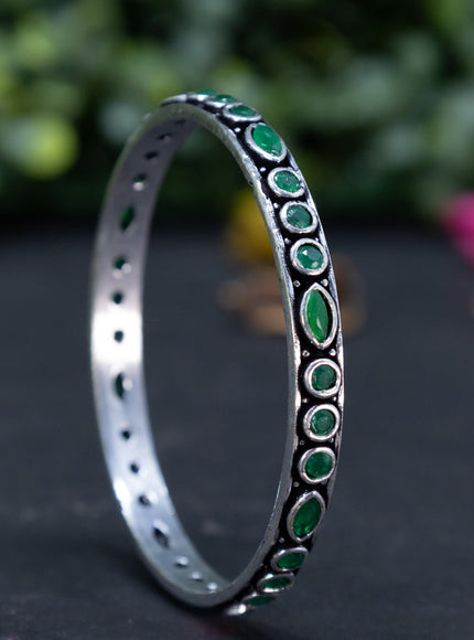 Oxidised bangle with emerald stones