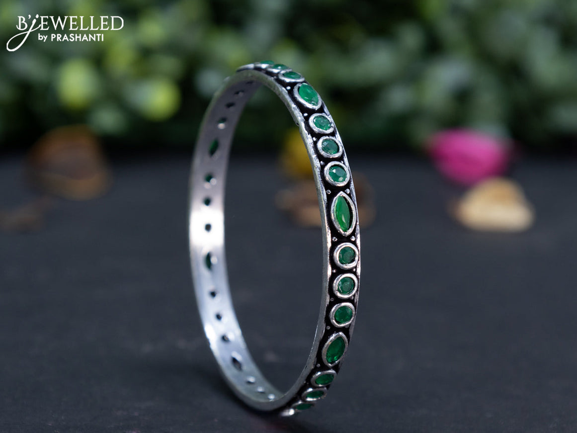 Oxidised bangle with emerald stones