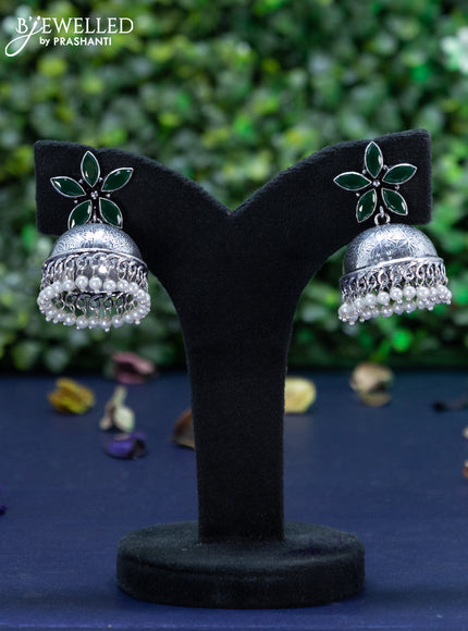 Oxidised jhumka floral design with emerald stones and pearl hangings