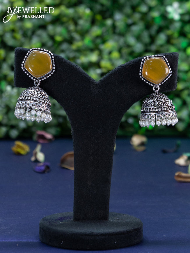 Oxidised jhumka with mustard yellow stone and pearl hangings