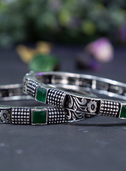 Oxidised  floral design bangles with emerald stones