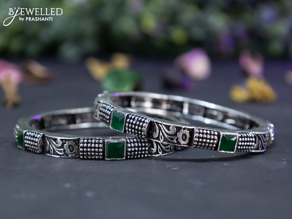 Oxidised  floral design bangles with emerald stones