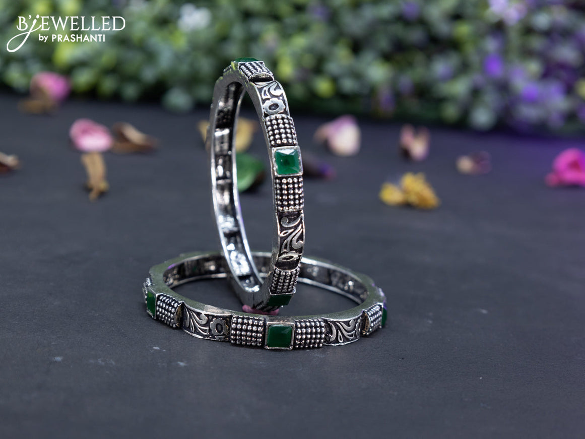 Oxidised  floral design bangles with emerald stones