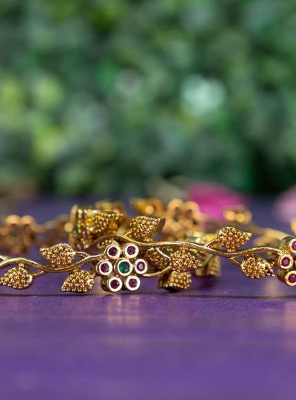 Antique floral design bangle with kemp stones