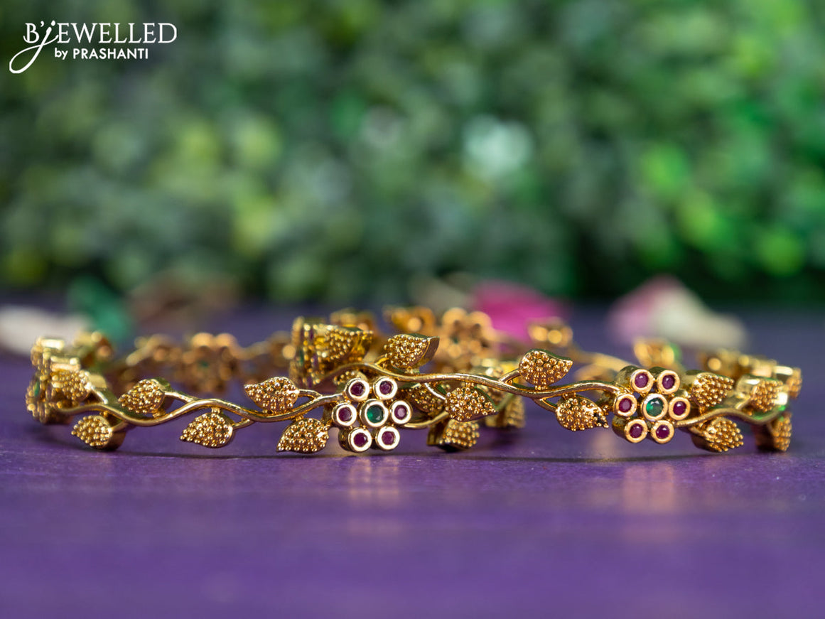 Antique floral design bangle with kemp stones