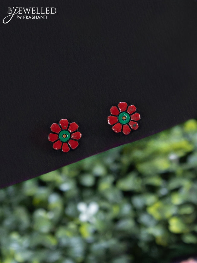 Terracotta red necklace with floral design