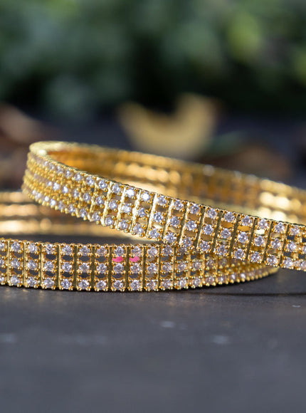 Zircon bangles with cz stones in gold finish