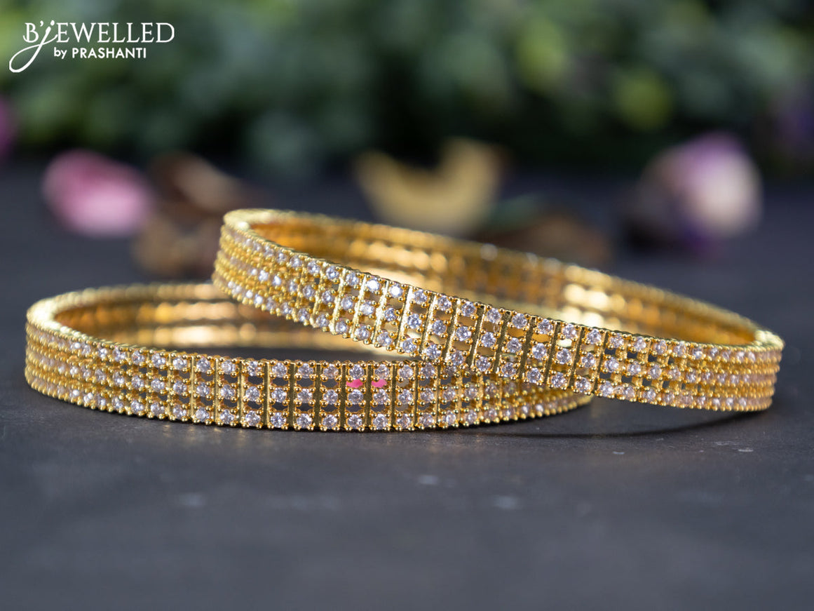 Zircon bangles with cz stones in gold finish