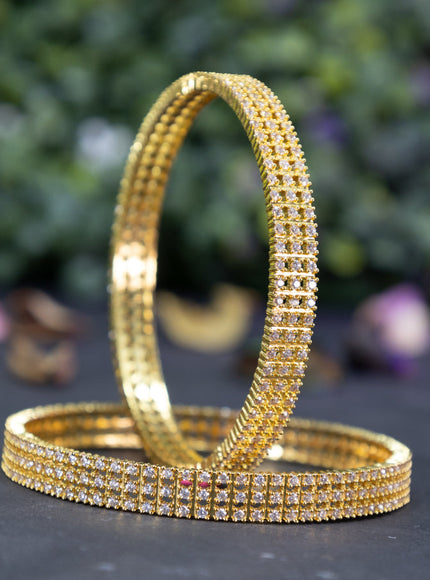 Zircon bangles with cz stones in gold finish