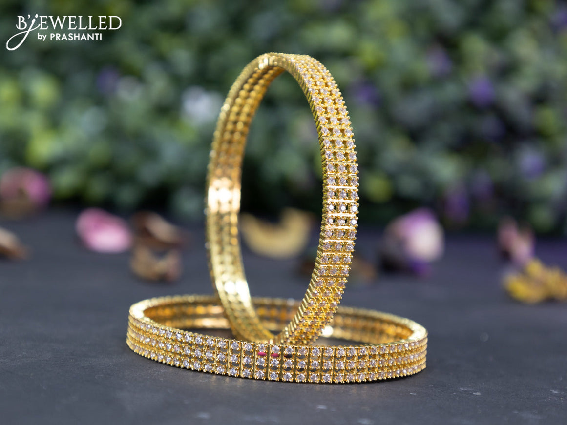 Zircon bangles with cz stones in gold finish