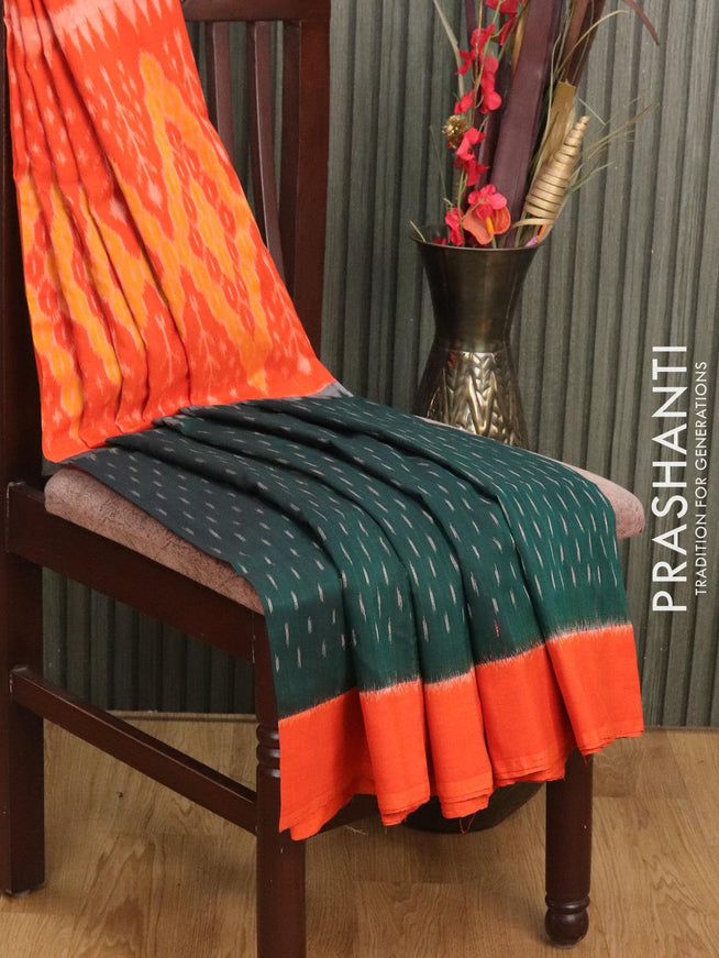 Ikat cotton saree dark green and orange with allover ikat butta weaves and printed border