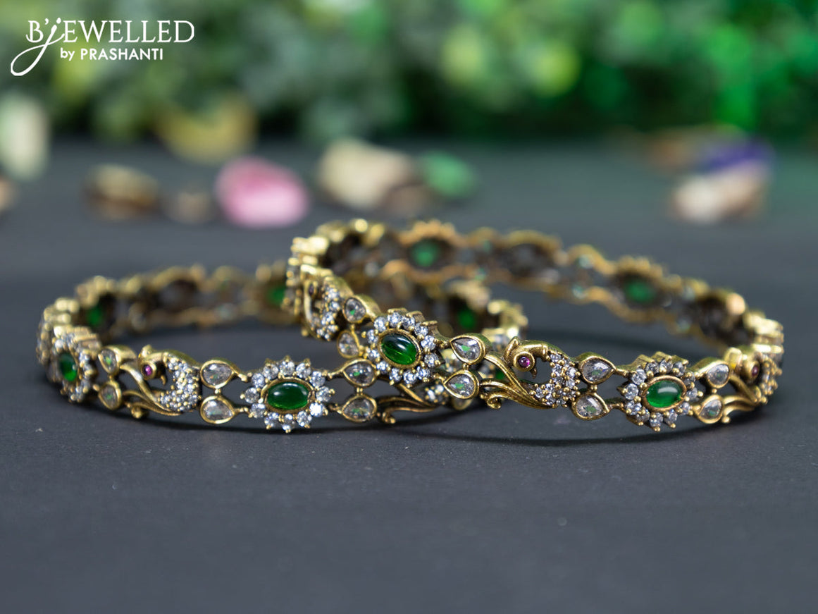 Victorian bangle peacock design with emerald and cz stones