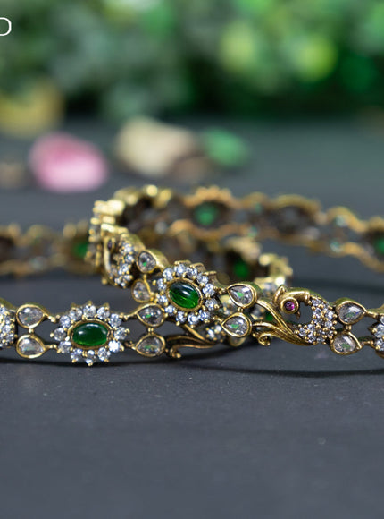 Victorian bangle peacock design with emerald and cz stones