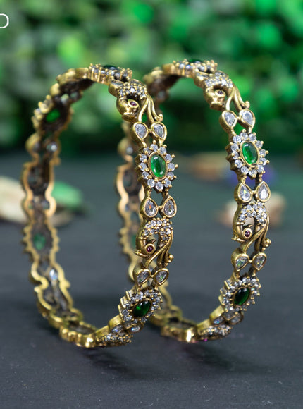 Victorian bangle peacock design with emerald and cz stones