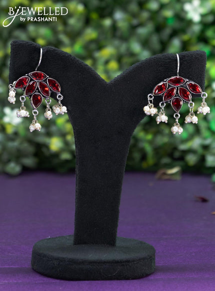 Oxidised hanging type earring with maroon stones and pearl hanhing