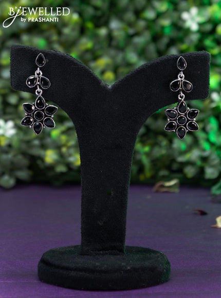 Oxidised floral design earring with black stones