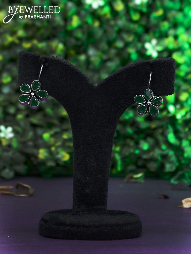 Oxidised hanging type earring with emerald stones