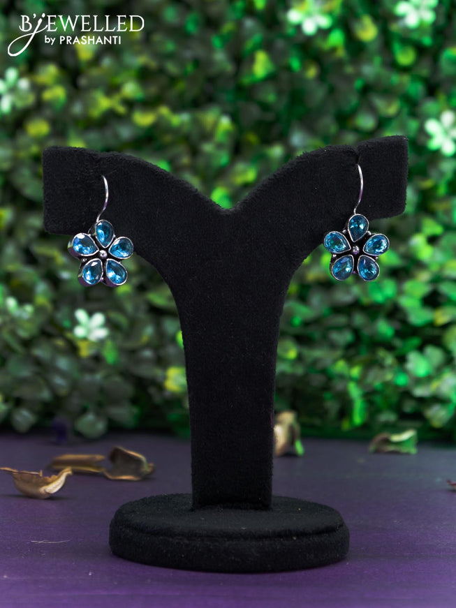 Oxidised hanging type earring with ice blue stones